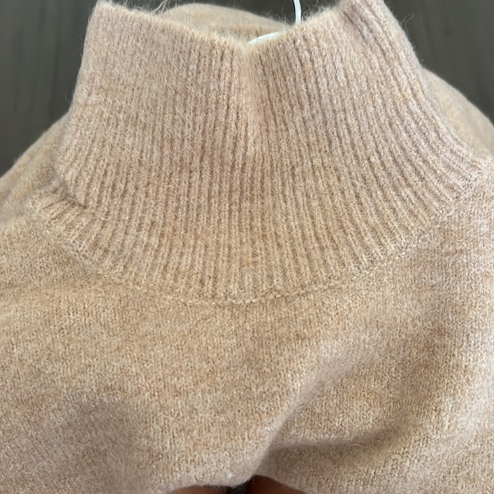 Zara High collar sweater with long sleeves.